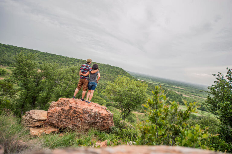 couple at the precipice at the top of Clayton Mountain, Sundance Club, Gordon, Texas